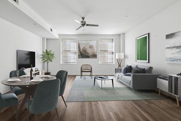 Dallas apartment for rent - A modern living room with a dining table set for two.