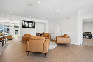 Charlotte apartment for rent - A living room with a large screen tv and comfortable seating.