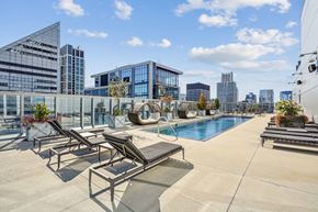 Chicago apartment for rent - the pool on the rooftop of a building with a city in the background