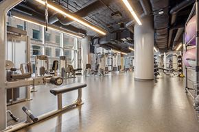 Chicago apartment for rent - a gym with weights and other exercise equipment in a building
