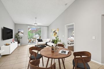 Coral Springs apartment for rent - A living room with a white couch and a wooden table.
