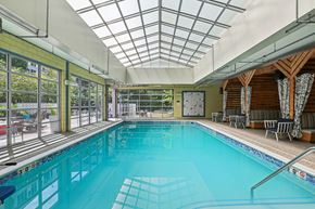 Pittsburgh apartment for rent - A large indoor swimming pool with a glass ceiling.