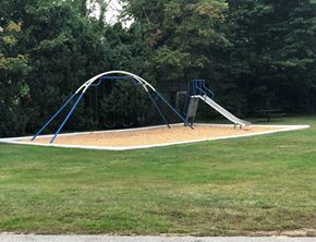 Milford apartment for rent - a playground with a swing set in a park