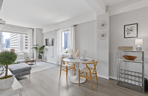 Atlanta apartment for rent - A modern dining room with a wooden table and chairs.