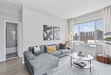 Atlanta apartment for rent - A living room with a grey couch and a coffee table.