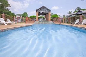 Rossville apartment for rent - a large swimming pool with a gazebo on the side of a house
