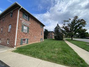 Bloomington apartment for rent - a red brick building on the side of a sidewalk
