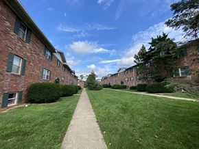 Bloomington apartment for rent - an image of a sidewalk in front of an apartment building