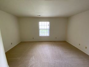 Bloomington apartment for rent - an empty room with white walls and a window