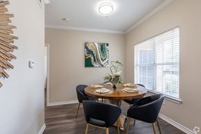 Houston apartment for rent - A dining room with a round table set for four.