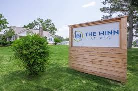 Rossville apartment for rent - the sign for the inn on the grass in front of a house
