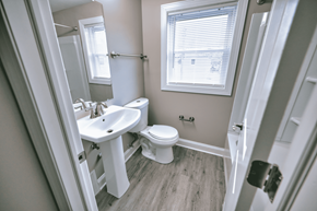 Tonawanda apartment for rent - a bathroom with a sink and a toilet and a window