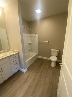 Getzville apartment for rent - a bathroom with a toilet and a shower and a sink