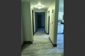Buffalo apartment for rent - a long hallway with a view of a kitchen and