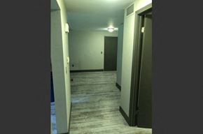 Buffalo apartment for rent - a empty room with a door open and a hallway