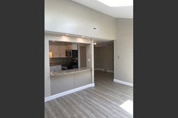 Buffalo apartment for rent - an empty living room with a kitchen in it