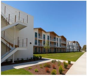 Fullerton apartment for rent - A row of modern apartment buildings with a clear blue sky above.
