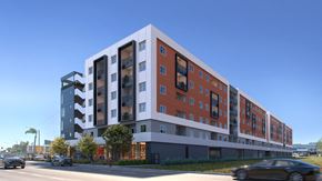 Torrance apartment for rent - A modern multi-story building with a mix of red and white colors at Tellus on Carson Apartments in Torrance, CA, 90502