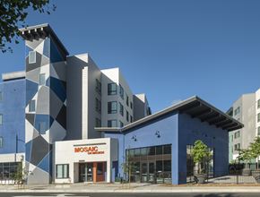 Hayward apartment for rent - A modern building with a blue and white facade and the words "MOSAIC" on the front.