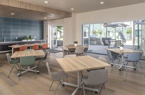 Hayward apartment for rent - A modern dining area with wooden tables and chairs.