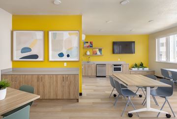 Hayward apartment for rent - A modern kitchen with a wooden table and chairs.