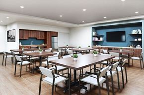 La Puente apartment for rent - a conference room with tables and chairs and a television