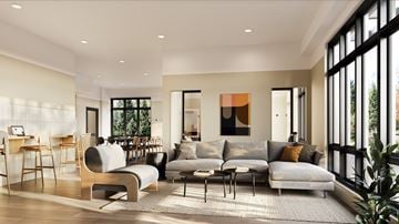 North Vancouver apartment for rent - A modern living room with a grey sofa and wooden chairs.