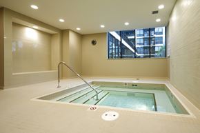 Calgary apartment for rent - A small indoor pool with a glass divider.