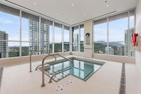 Coquitlam apartment for rent - A glass pool in a room with a view of the city.