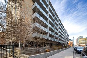 Calgary apartment for rent - A large building with a lot of windows and balconies.
