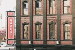 Victoria apartment for rent - A red and white sign that says Rocket on the side of a building.