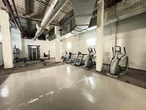 Los Angeles apartment for rent - A gym with a row of treadmills and elliptical machines.