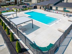 Elizabethtown apartment for rent - A large outdoor swimming pool surrounded by a black fence.