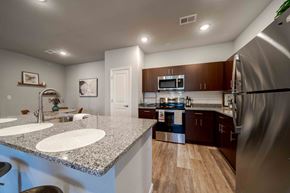 Elizabethtown apartment for rent - a kitchen with stainless steel appliances and granite counter tops