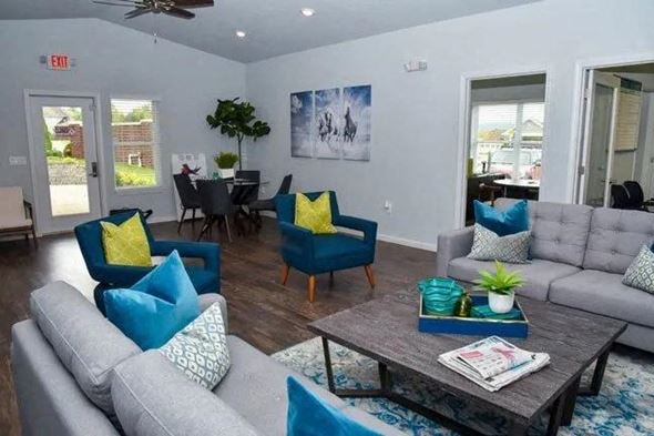 Louisville apartment for rent - a living room with couches and chairs and a table