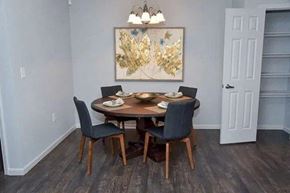 Louisville apartment for rent - a dining room with a table and chairs