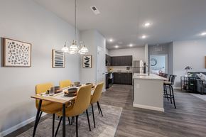 New Albany apartment for rent - an open kitchen and dining room with a table and chairs
