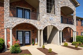 Sellersburg apartment for rent - a brick building with three archways and a sidewalk