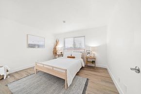 Compton apartment for rent - a bedroom with a bed and a rug