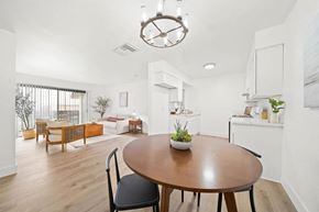 Compton apartment for rent - a dining room and living room with a table