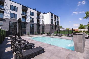 A swimming pool in front of a building