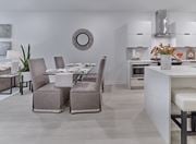 Franklin Lakes apartment for rent - A modern dining room with a white table and grey chairs.
