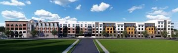 Woodbridge apartment for rent - A large building with a grassy area in front.