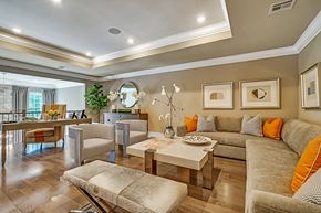 Mountainside apartment for rent - A living room with a grey couch and a coffee table.