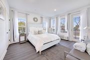 Hillsborough Township apartment for rent - a white bedroom with a large bed and windows at The Franklin at Hillsborough Apartments, Hillsborough, New Jersey