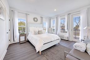Hillsborough Township apartment for rent - a white bedroom with a large bed and windows at The Franklin at Hillsborough Apartments, Hillsborough, New Jersey