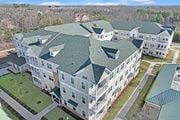 Hillsborough Township apartment for rent - an aerial view of an apartment building with green roofs at The Franklin at Hillsborough Apartments, Hillsborough, NJ