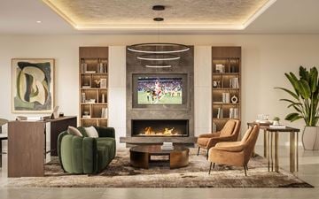 Woodbridge apartment for rent - A modern living room with a fireplace and a television.