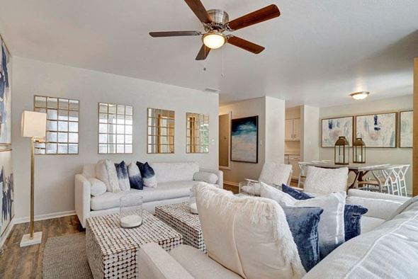 Fort Walton Beach apartment for rent - a living room filled with furniture and a ceiling fan at Estates at Palm Bay, Fort Walton Beach, Florida