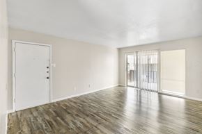 Fort Worth apartment for rent - A room with wooden flooring and a white door.